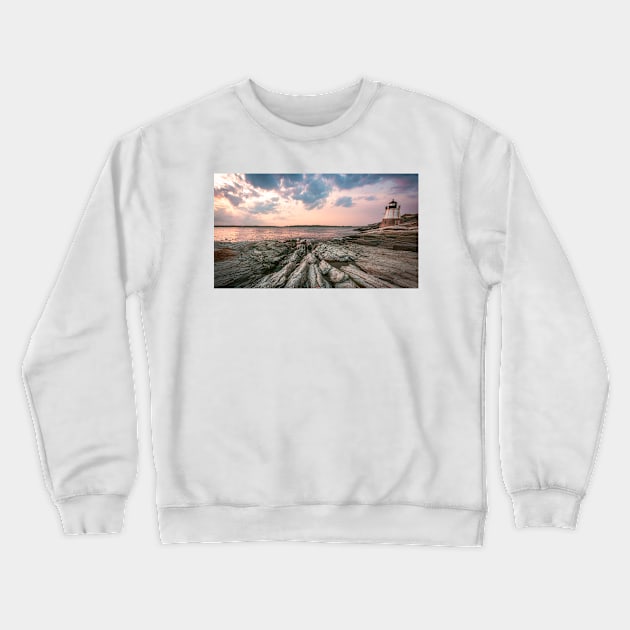 Lighthouse on a rocky beach Crewneck Sweatshirt by jswolfphoto